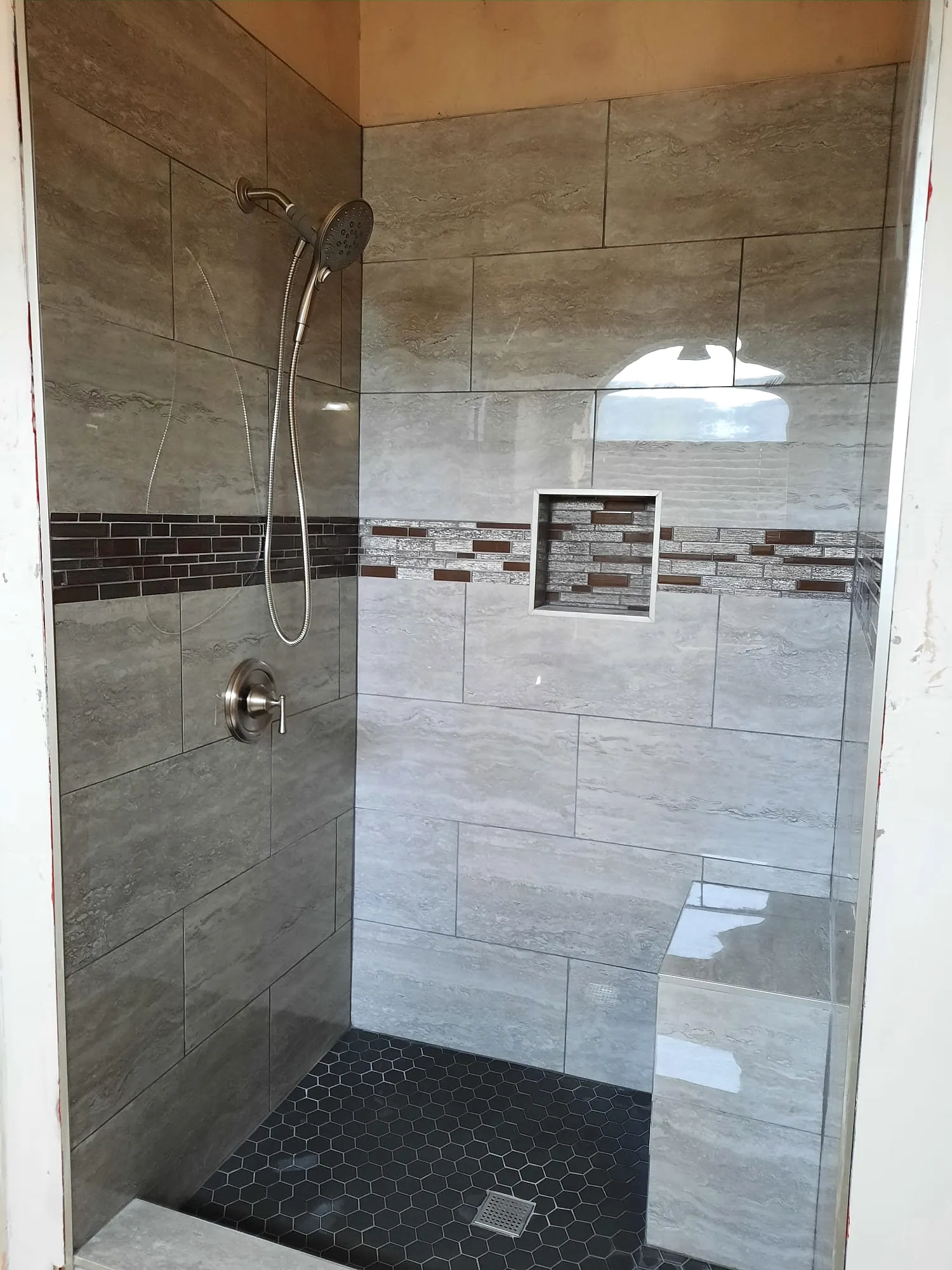 Tiled shower with a bench